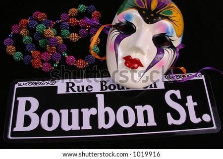 stock-photo-bourbon-street-beads-and-single-mardi-gras-mask-1019916.jpg