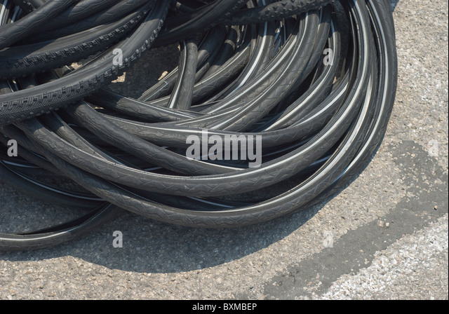 stack-of-bicycle-tires-on-the-street-bxmbep.jpg